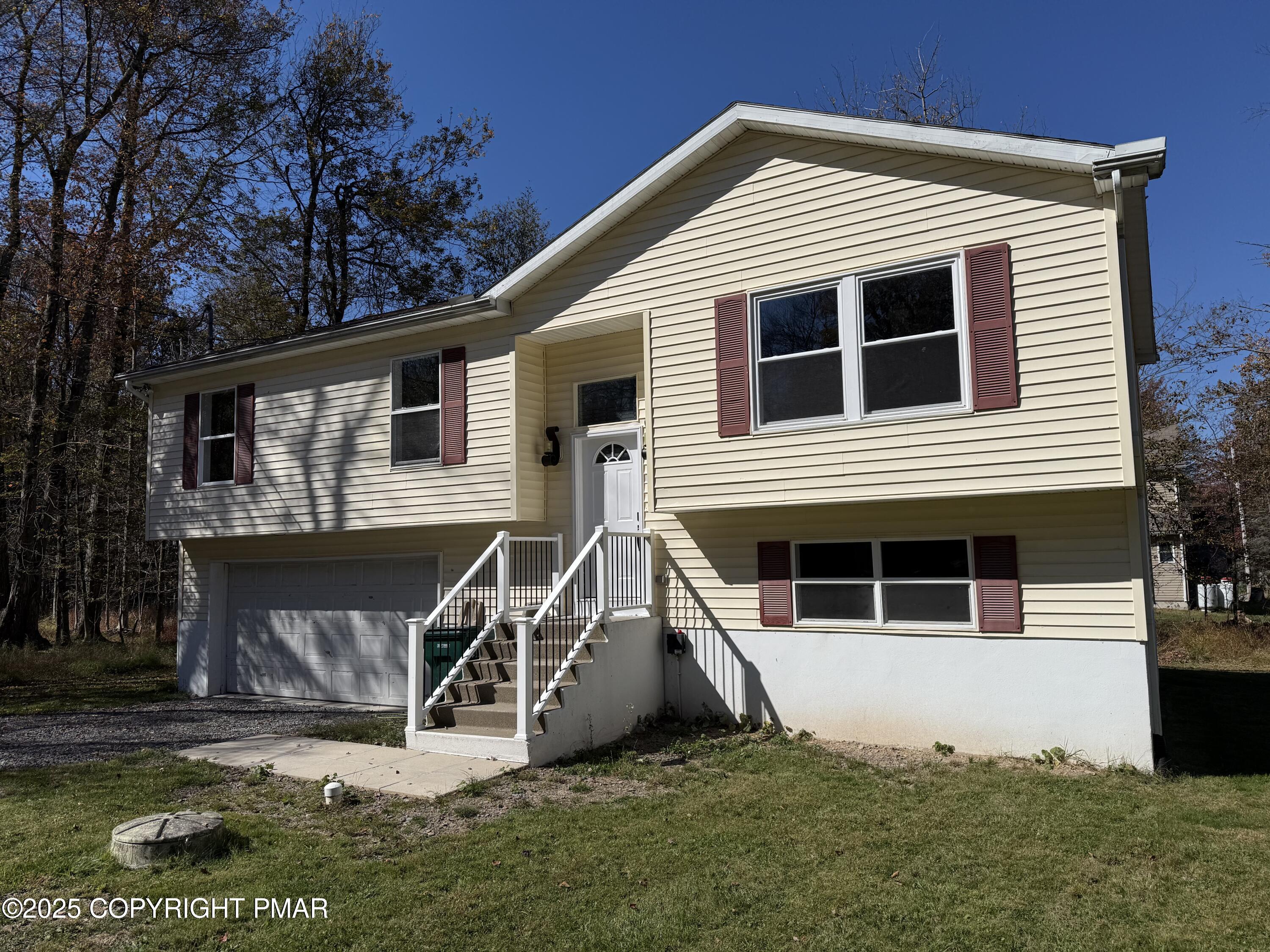 1753 Rolling Hills Drive Tobyhanna, PA 18466 - Photo 1 of 25 a front view of a house with a yard