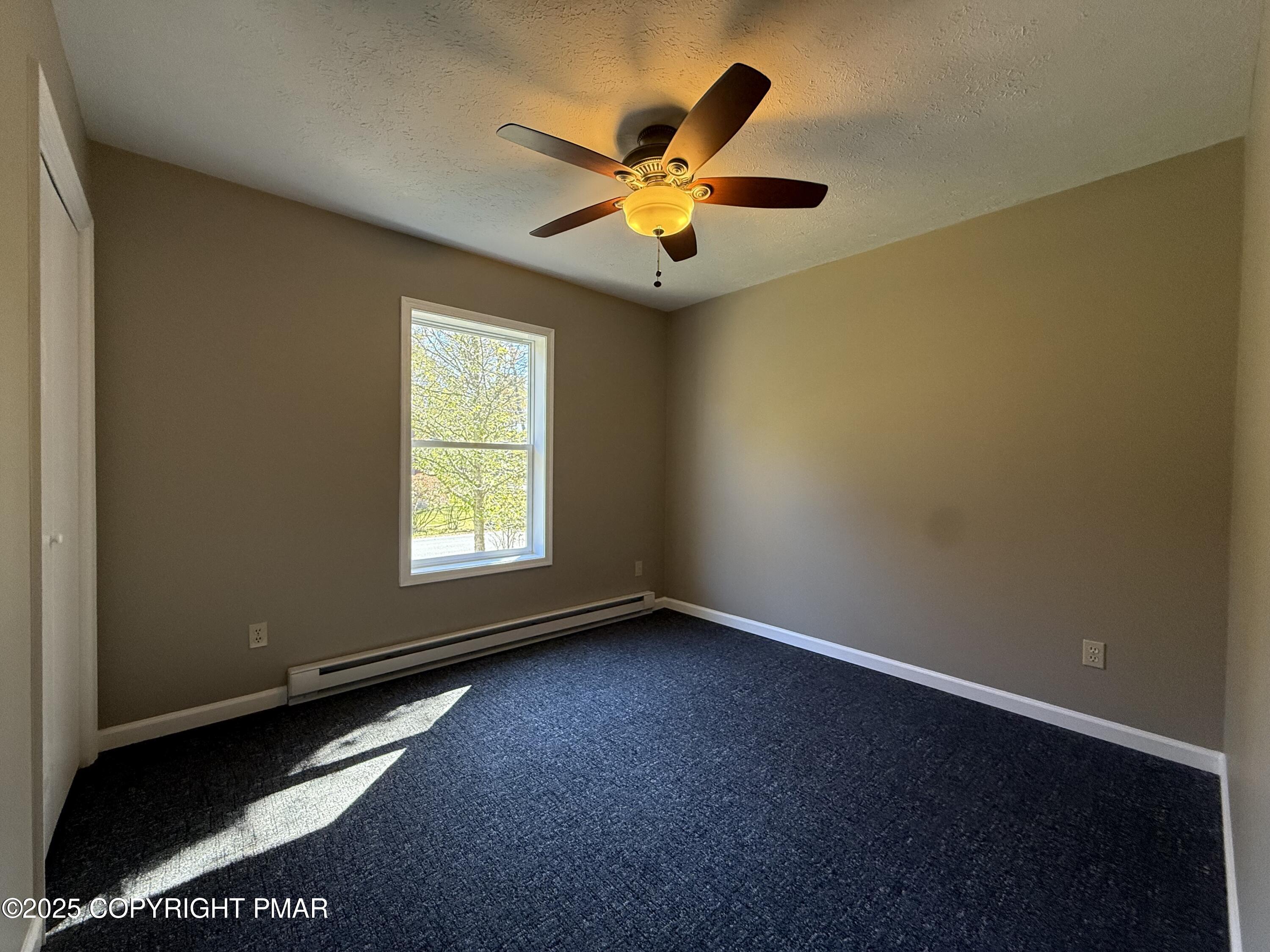 1753 Rolling Hills Drive Tobyhanna, PA 18466 - Photo 12 of 25 an empty room with window and ceiling fan