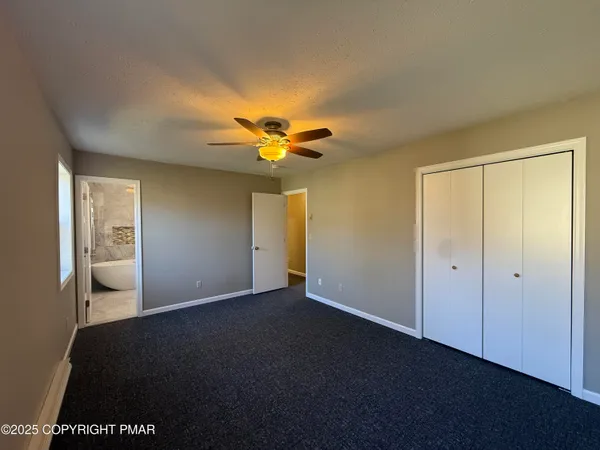 a bathroom with a toilet a sink and bathtub