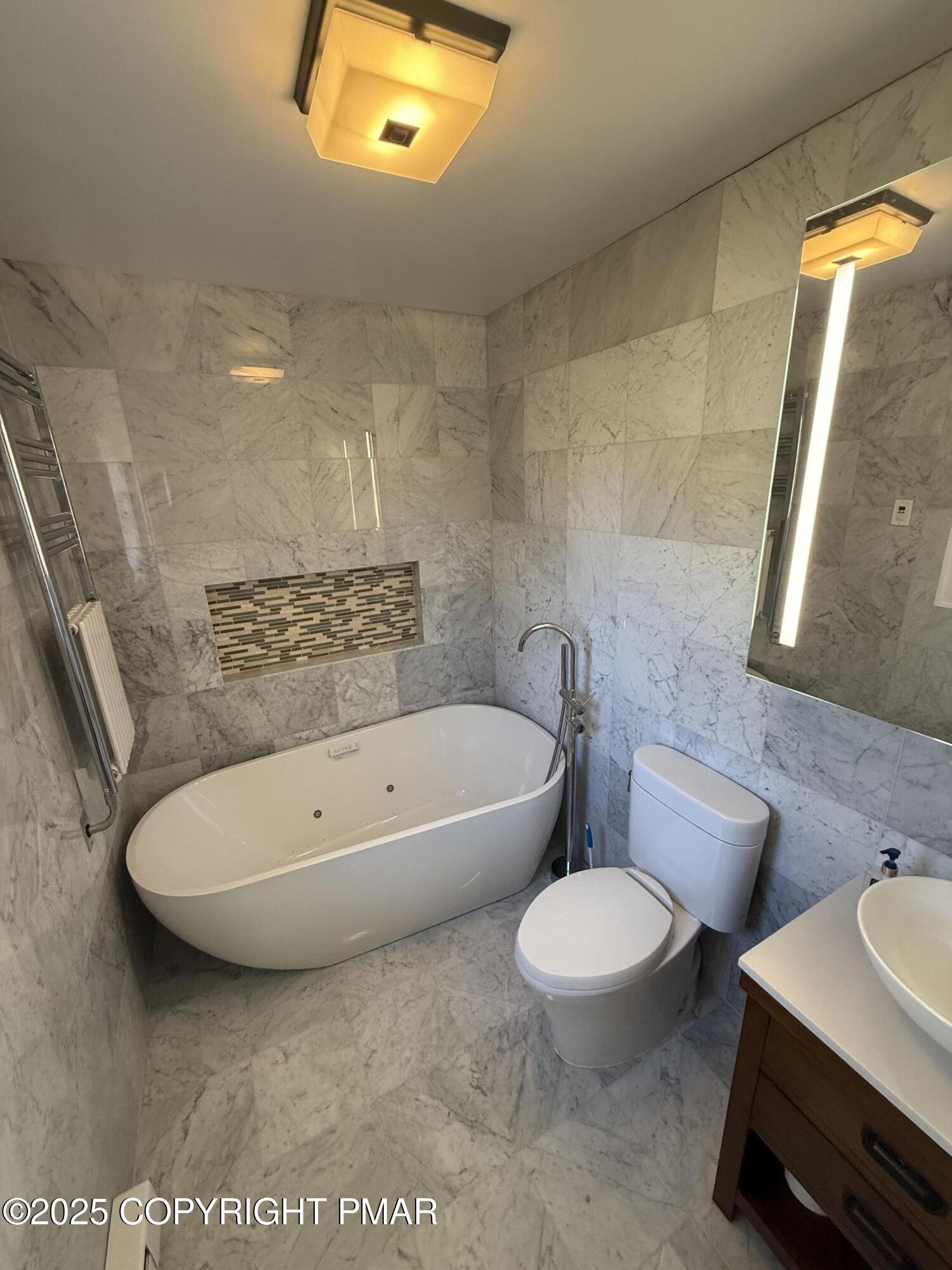 1753 Rolling Hills Drive Tobyhanna, PA 18466 - Photo 17 of 25 a bathroom with a toilet a sink and bathtub