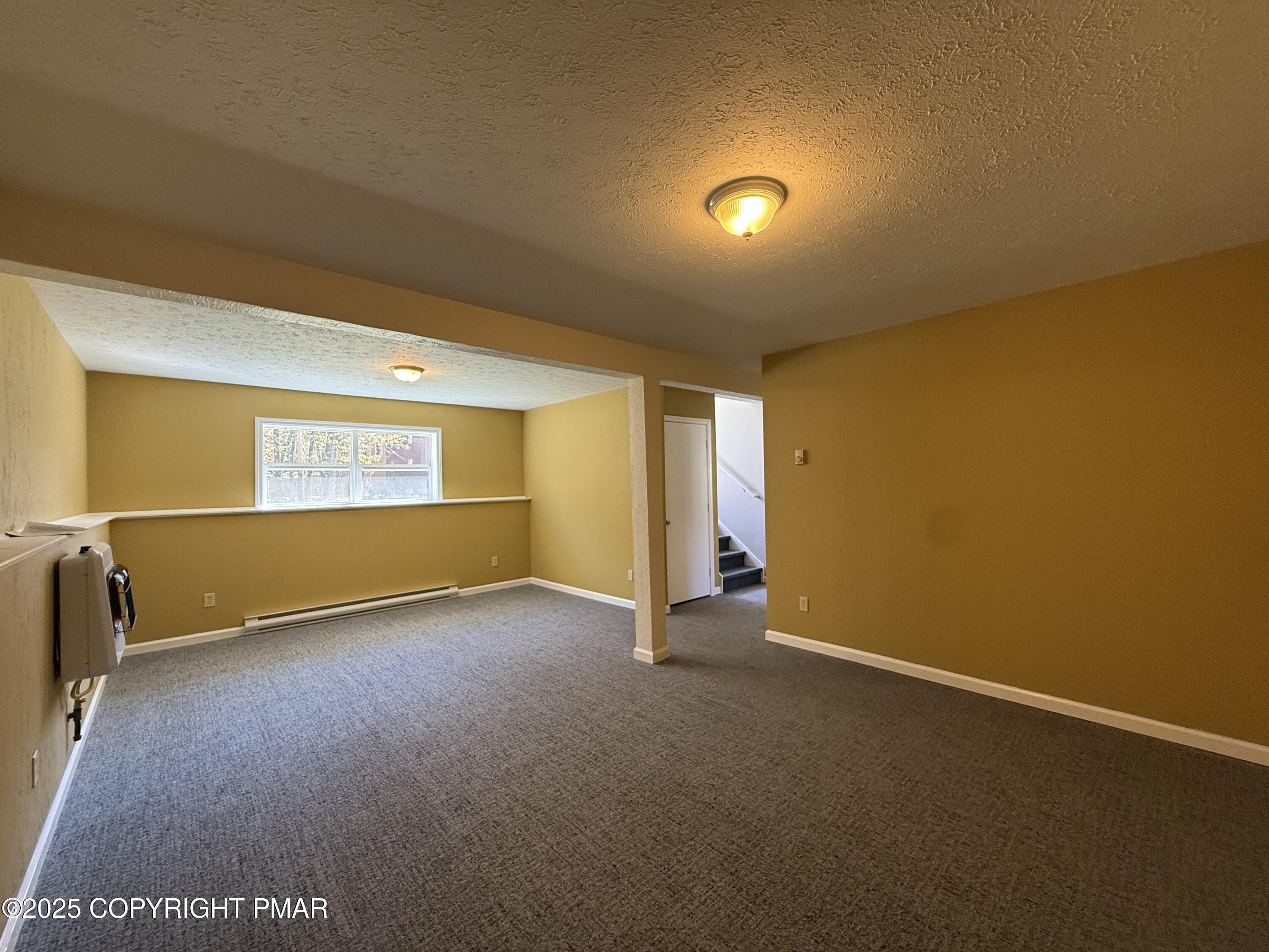 1753 Rolling Hills Drive Tobyhanna, PA 18466 - Photo 20 of 25 an empty room with a empty space and windows