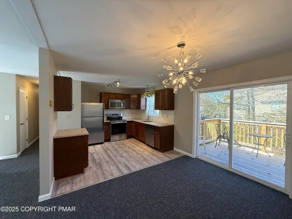 a view of livingroom with hardwood floor and a ceiling fan