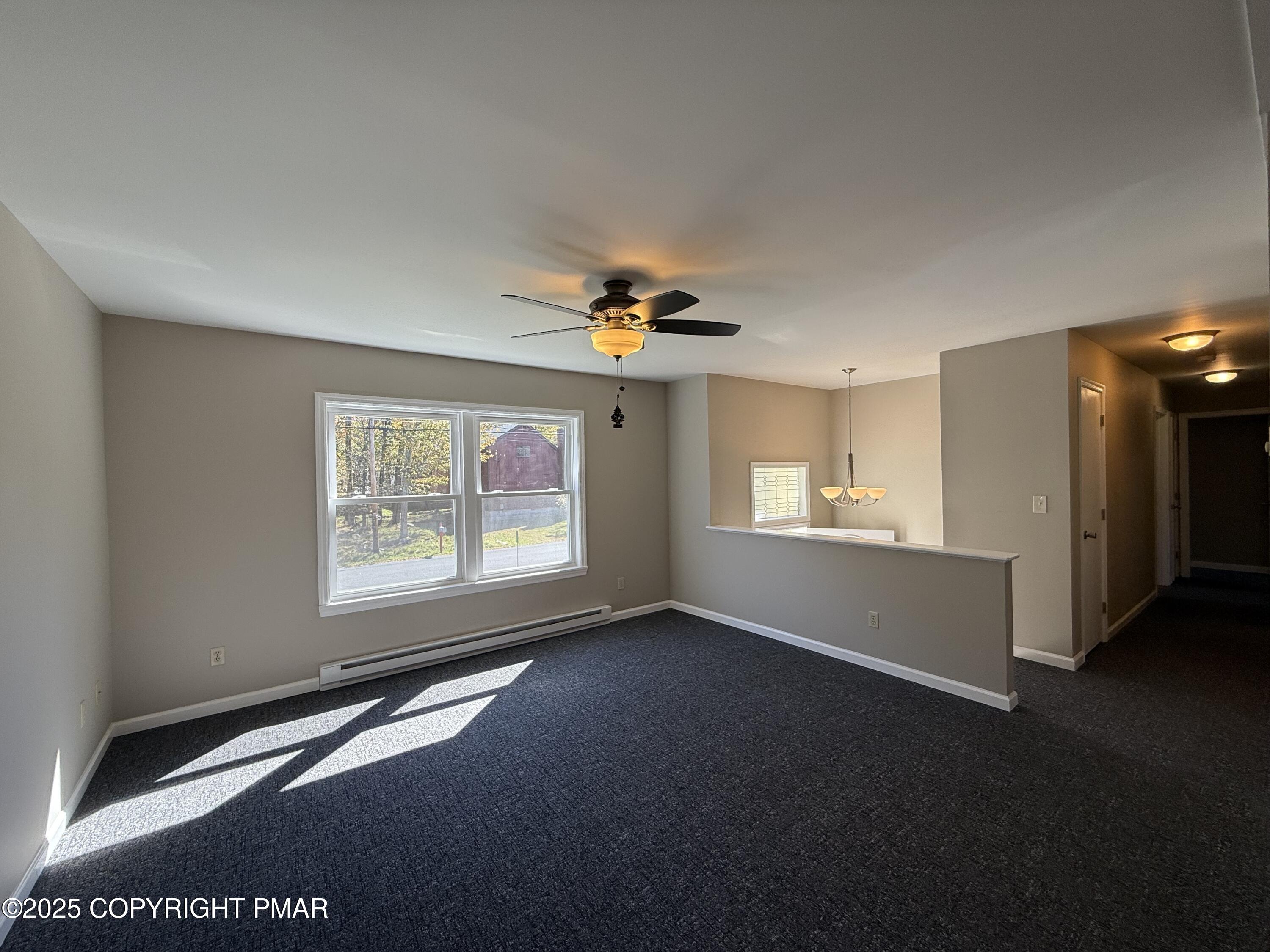 1753 Rolling Hills Drive Tobyhanna, PA 18466 - Photo 8 of 25 a view of livingroom with hardwood floor and a ceiling fan