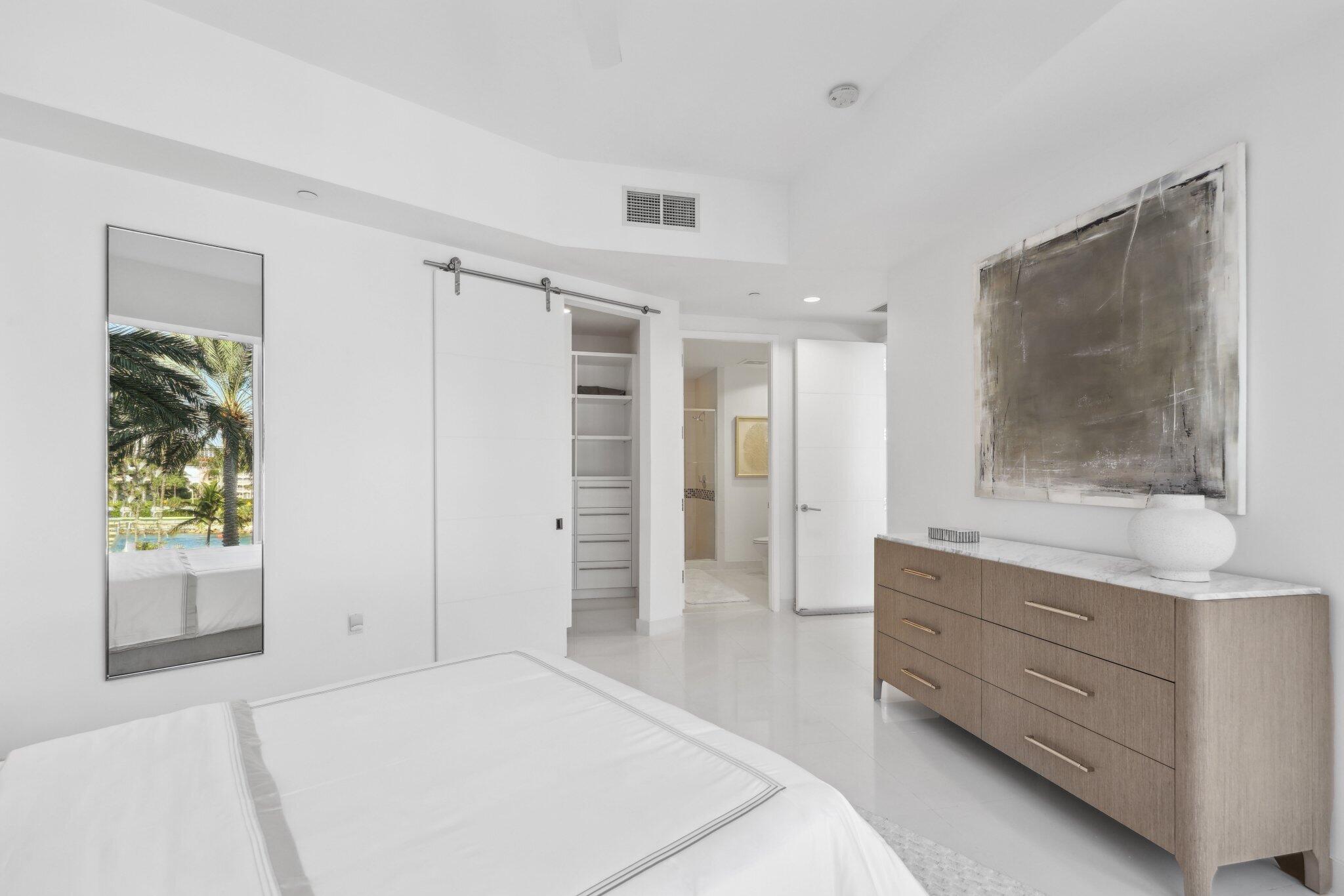 1000 South Ocean Boulevard, Unit 309 Boca Raton, FL 33432 - Photo 24 of 63 a spacious bedroom with a bed and a window