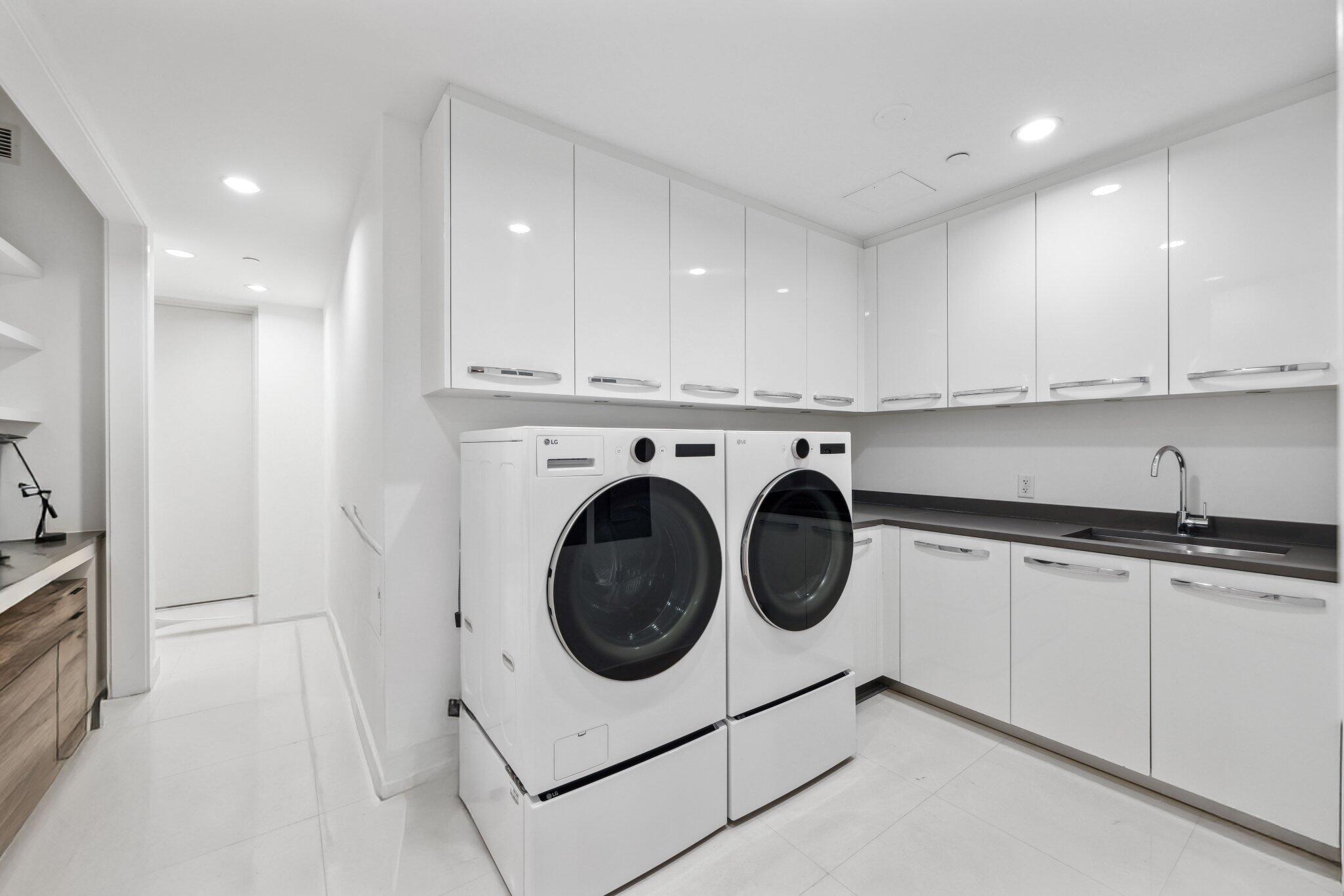1000 South Ocean Boulevard, Unit 309 Boca Raton, FL 33432 - Photo 37 of 63 a utility room with sink dryer and washer