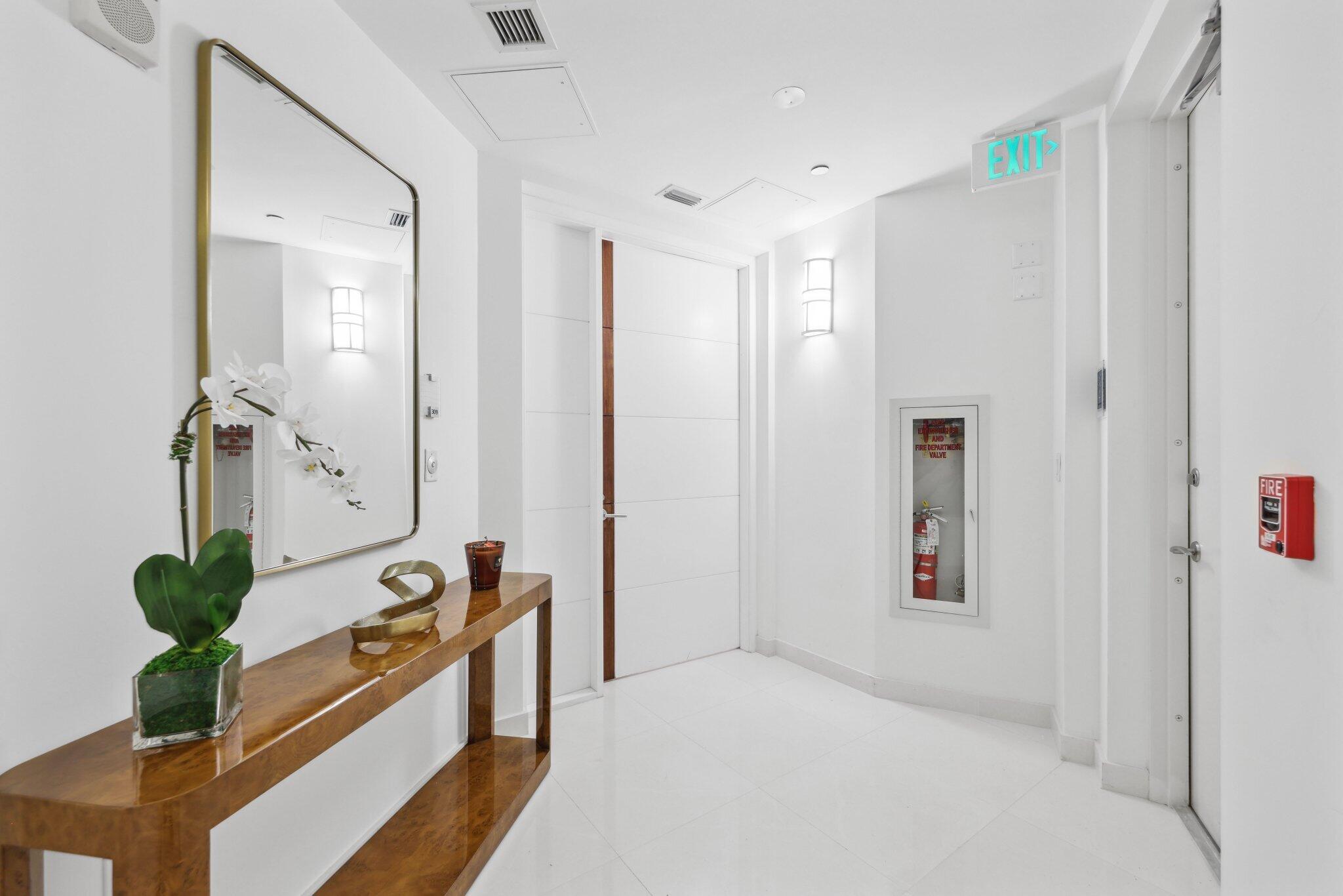 1000 South Ocean Boulevard, Unit 309 Boca Raton, FL 33432 - Photo 5 of 63 a view of a bathroom with a tub shower and mirror