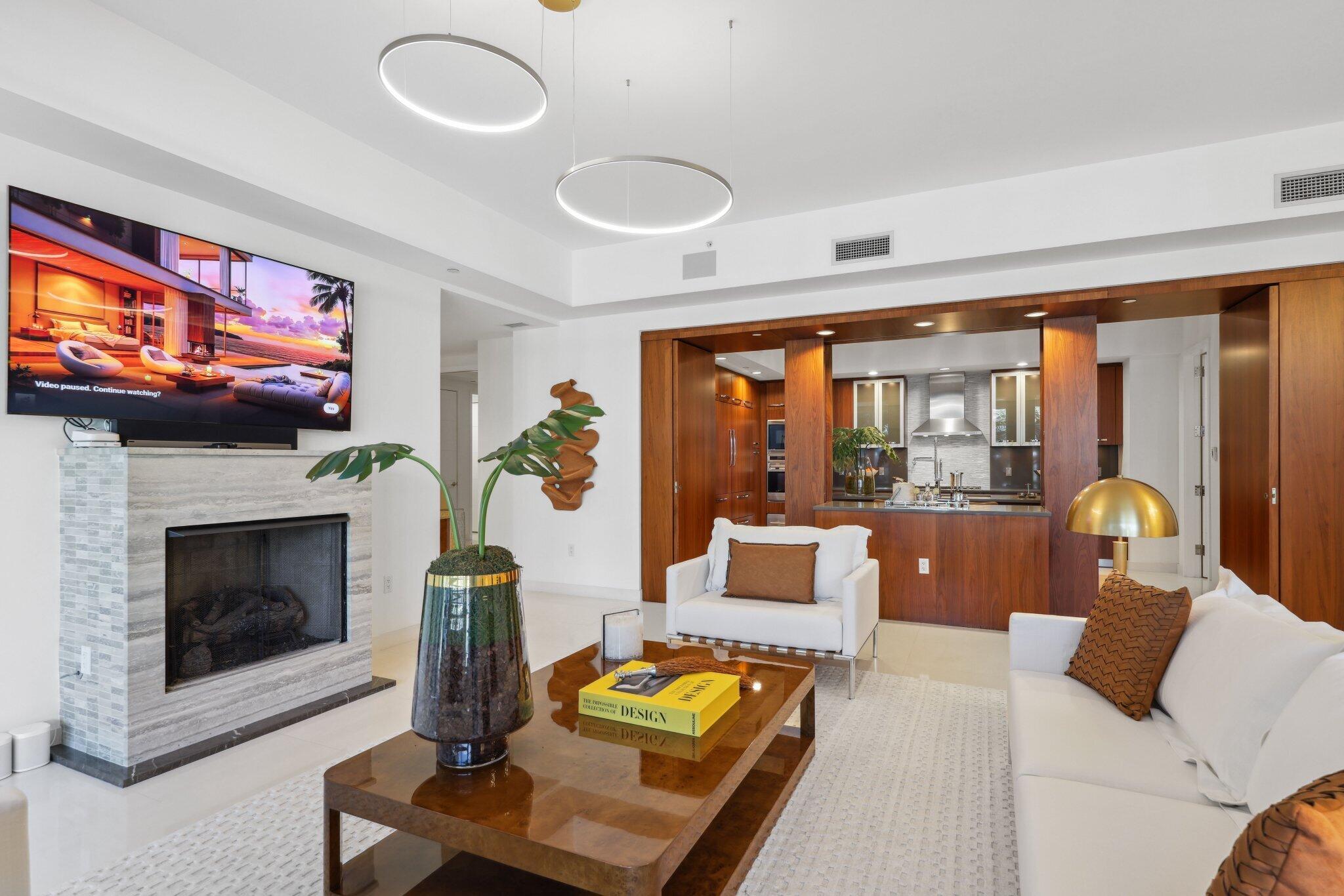 1000 South Ocean Boulevard, Unit 309 Boca Raton, FL 33432 - Photo 9 of 63 a living room with furniture fireplace and flat screen tv