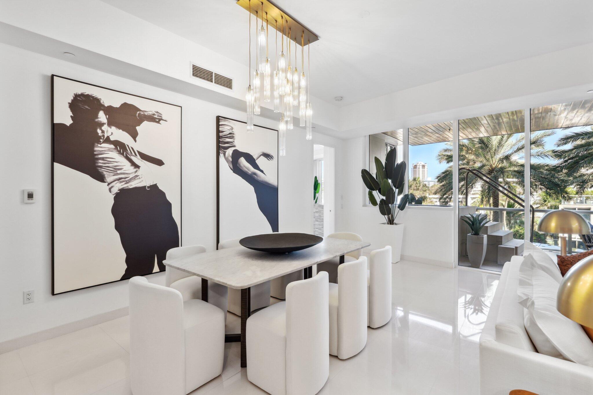 1000 South Ocean Boulevard, Unit 309 Boca Raton, FL 33432 - Photo 10 of 63 a view of a dining room with furniture and chandelier