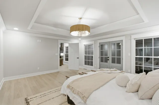 a view of a living room with furniture and a chandelier
