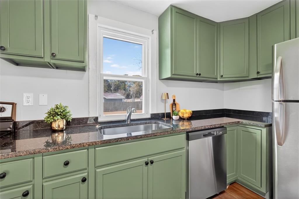 132 Victory Drive Monroe, GA 30655 - Photo 13 of 36 a kitchen with sink and cabinets