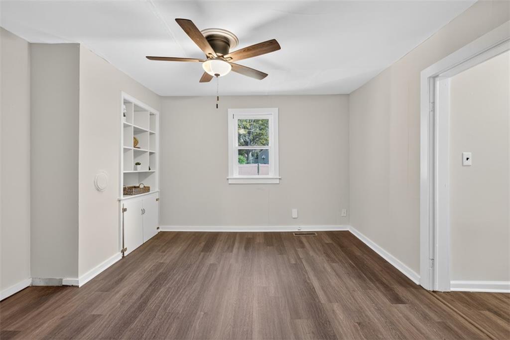 132 Victory Drive Monroe, GA 30655 - Photo 17 of 36 a view of a big room with wooden floor and windows