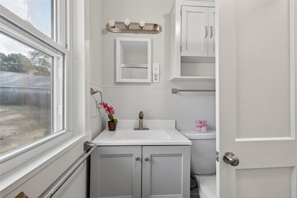 132 Victory Drive Monroe, GA 30655 - Photo 19 of 36 a bathroom with a sink and a vanity