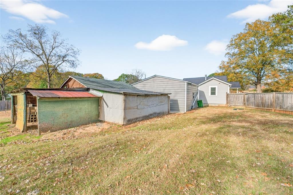 132 Victory Drive Monroe, GA 30655 - Photo 28 of 36 a view of a house with a yard and garage