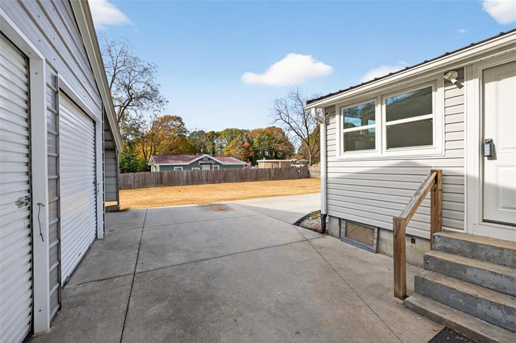 132 Victory Drive Monroe, GA 30655 - Photo 29 of 36 a view of a terrace with a table and chairs