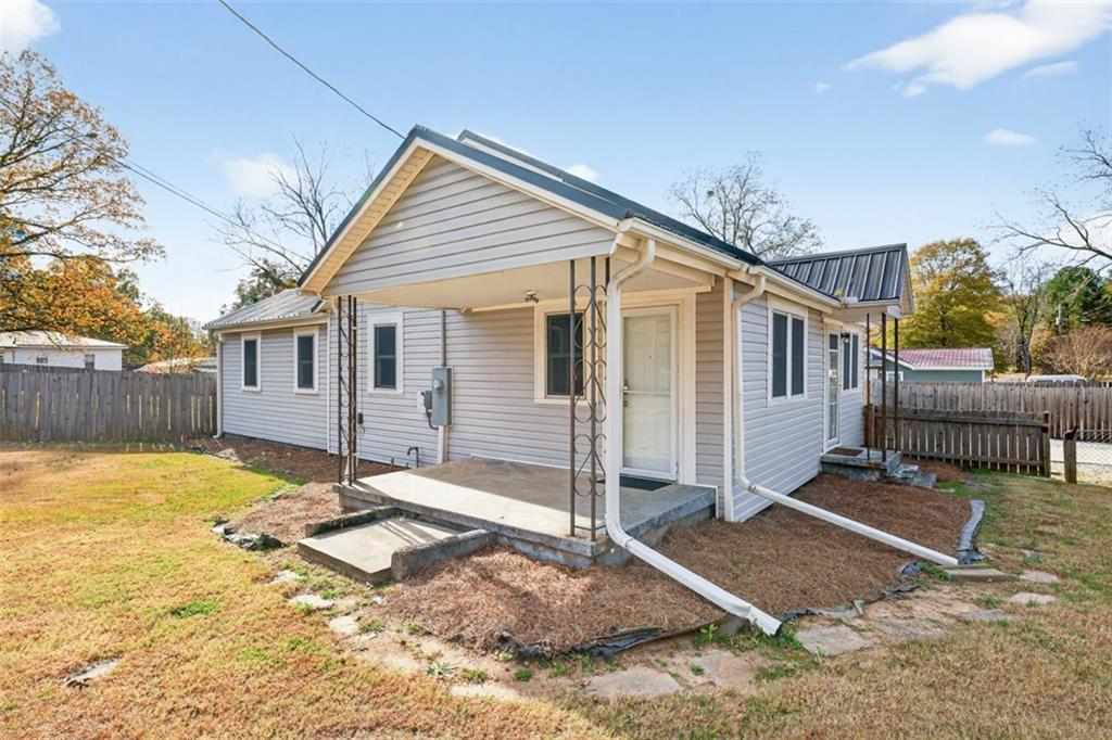 132 Victory Drive Monroe, GA 30655 - Photo 32 of 36 a view of a house with wooden floor next to a yard