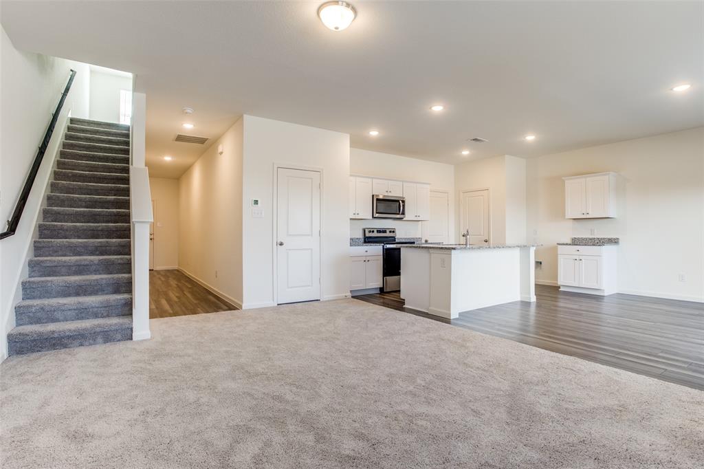 622 Colgate Circle Princeton, TX 75407 - Photo 12 of 12 Kitchen with white cabinets, open floor plan, appliances with stainless steel finishes, and recessed lighting