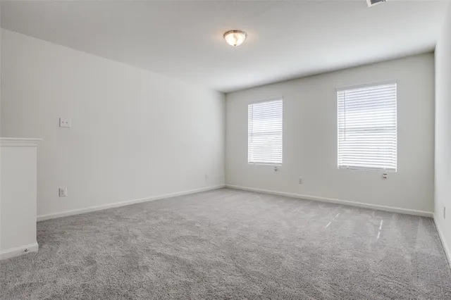 a kitchen with stainless steel appliances granite countertop a stove a sink and a large window