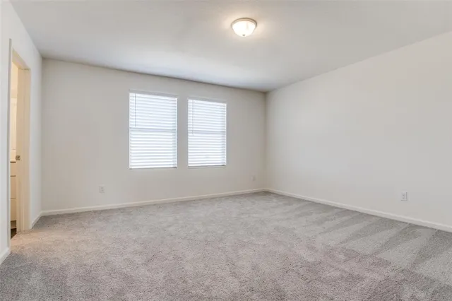 a view of kitchen with wooden floor and electronic appliances