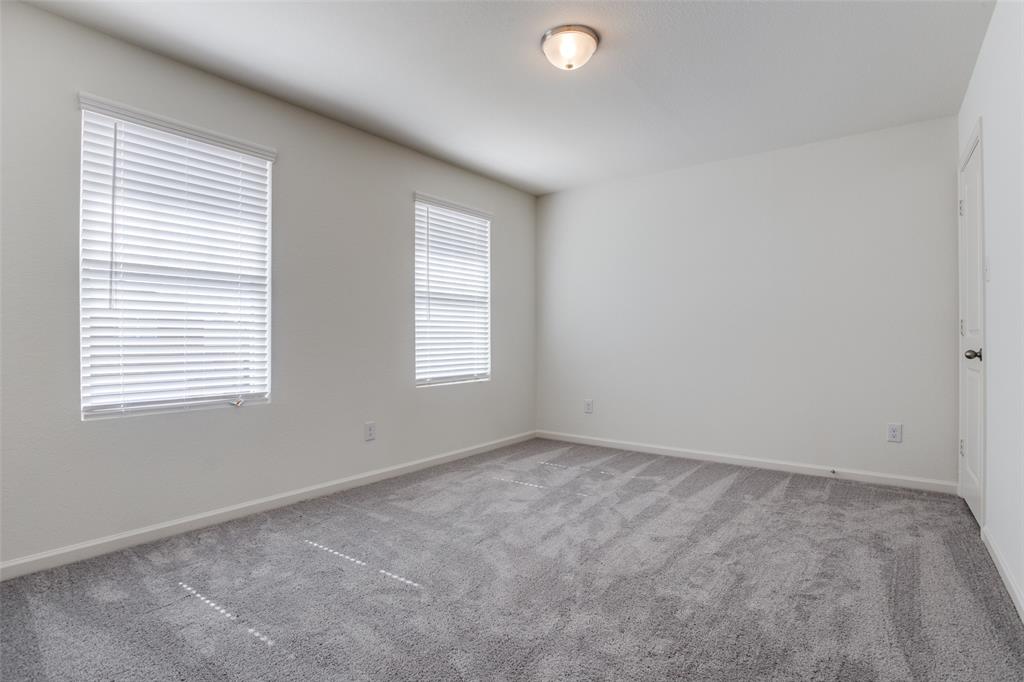 622 Colgate Circle Princeton, TX 75407 - Photo 7 of 12 Bedroom featuring carpet flooring and baseboards