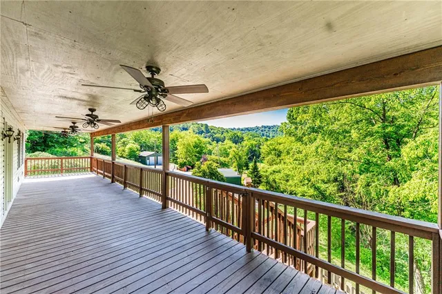 a view of a balcony with wooden floor