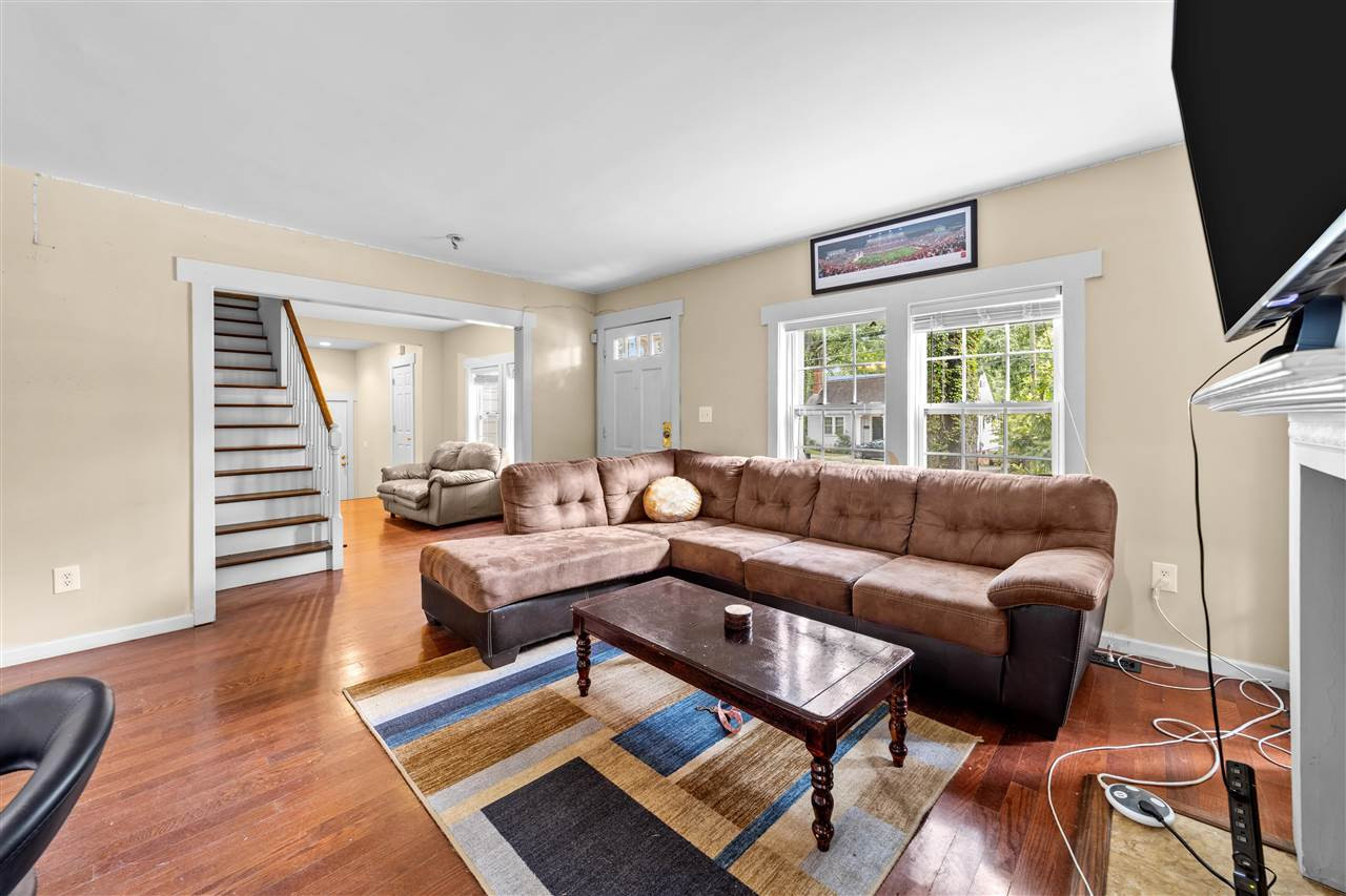 407 Brooks Avenue Raleigh, NC 27607 - Photo 11 of 30 a living room with furniture and wooden floor