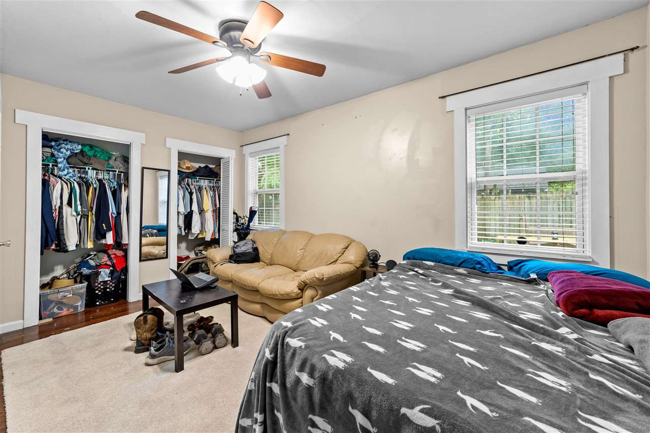 407 Brooks Avenue Raleigh, NC 27607 - Photo 15 of 30 a bedroom with furniture and a window