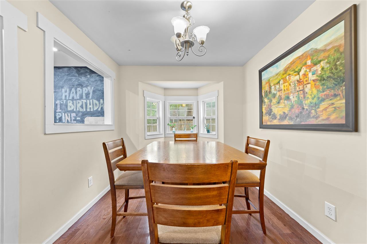 407 Brooks Avenue Raleigh, NC 27607 - Photo 19 of 30 a view of a dining room with furniture window and wooden floor