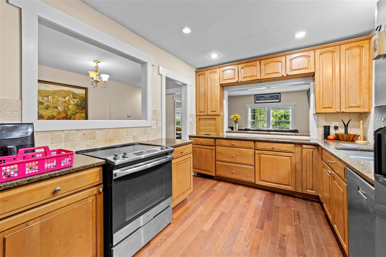 407 Brooks Avenue Raleigh, NC 27607 - Photo 22 of 30 a kitchen with a stove a sink and a window