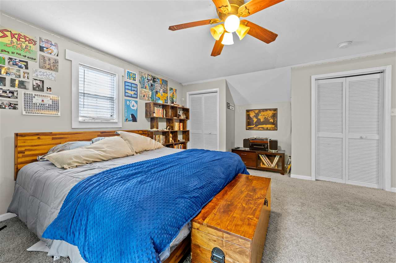 407 Brooks Avenue Raleigh, NC 27607 - Photo 26 of 30 a bed room with a bed and a tv