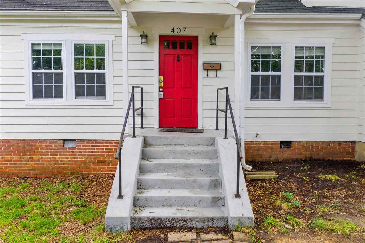 407 Brooks Avenue Raleigh, NC 27607 - Photo 3 of 30 a front view of a house with a yard