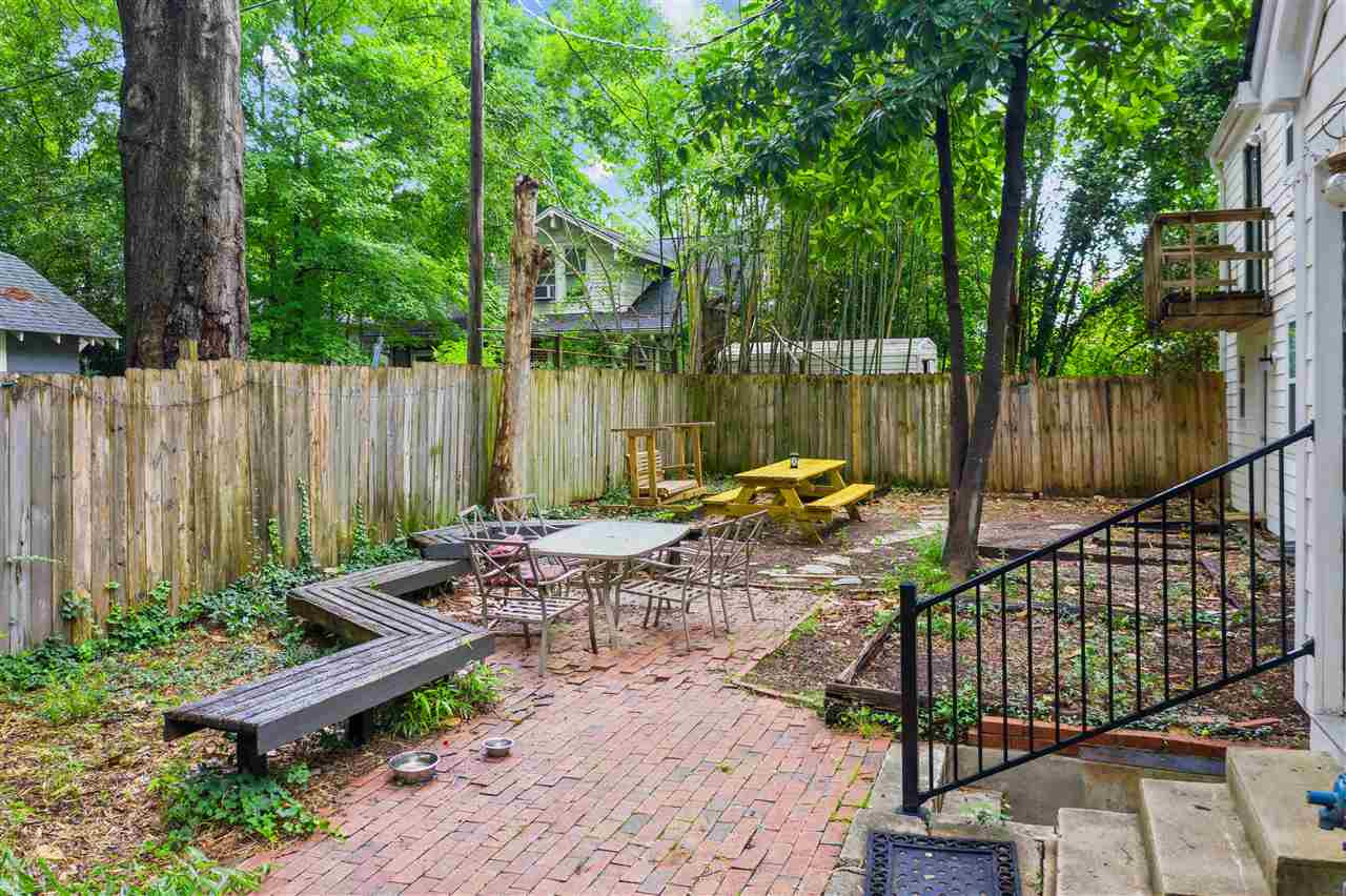 407 Brooks Avenue Raleigh, NC 27607 - Photo 7 of 30 a view of outdoor space with seating area and garden