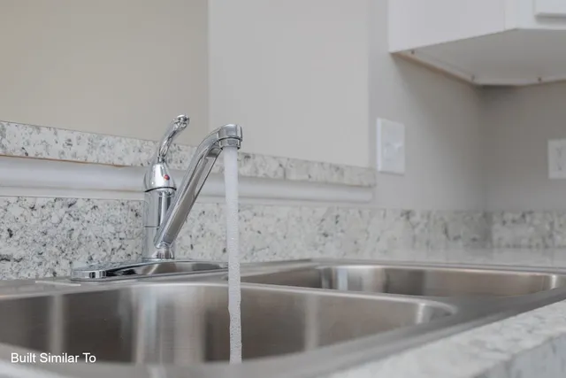 a view closed with a sink and mirror