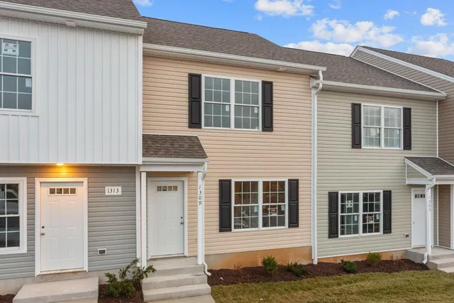 a front view of a house with a lots of windows