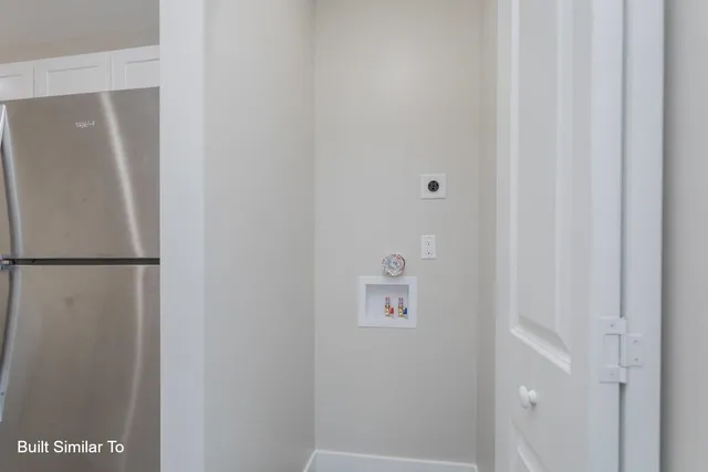 a view of a kitchen island with furniture and wooden floor