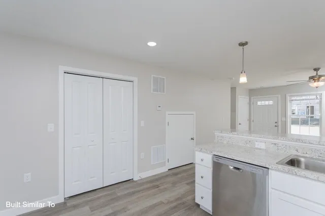 a bathroom with a granite countertop sink
