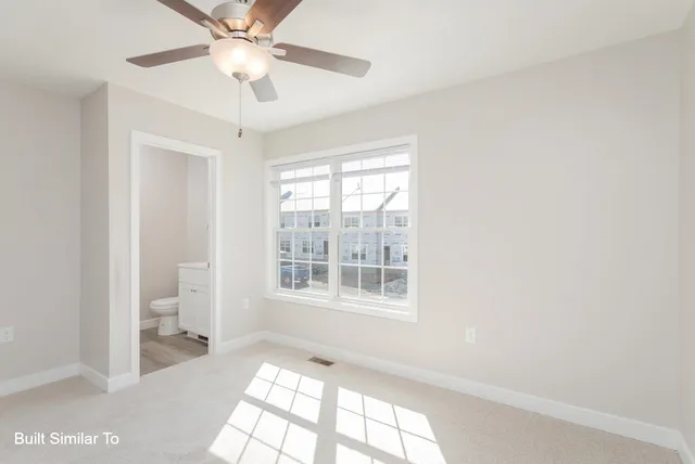 a bathroom with a sink toilet and a mirror