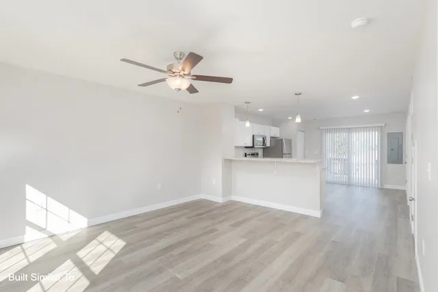 a view of a kitchen with a dishwasher and a refrigerator