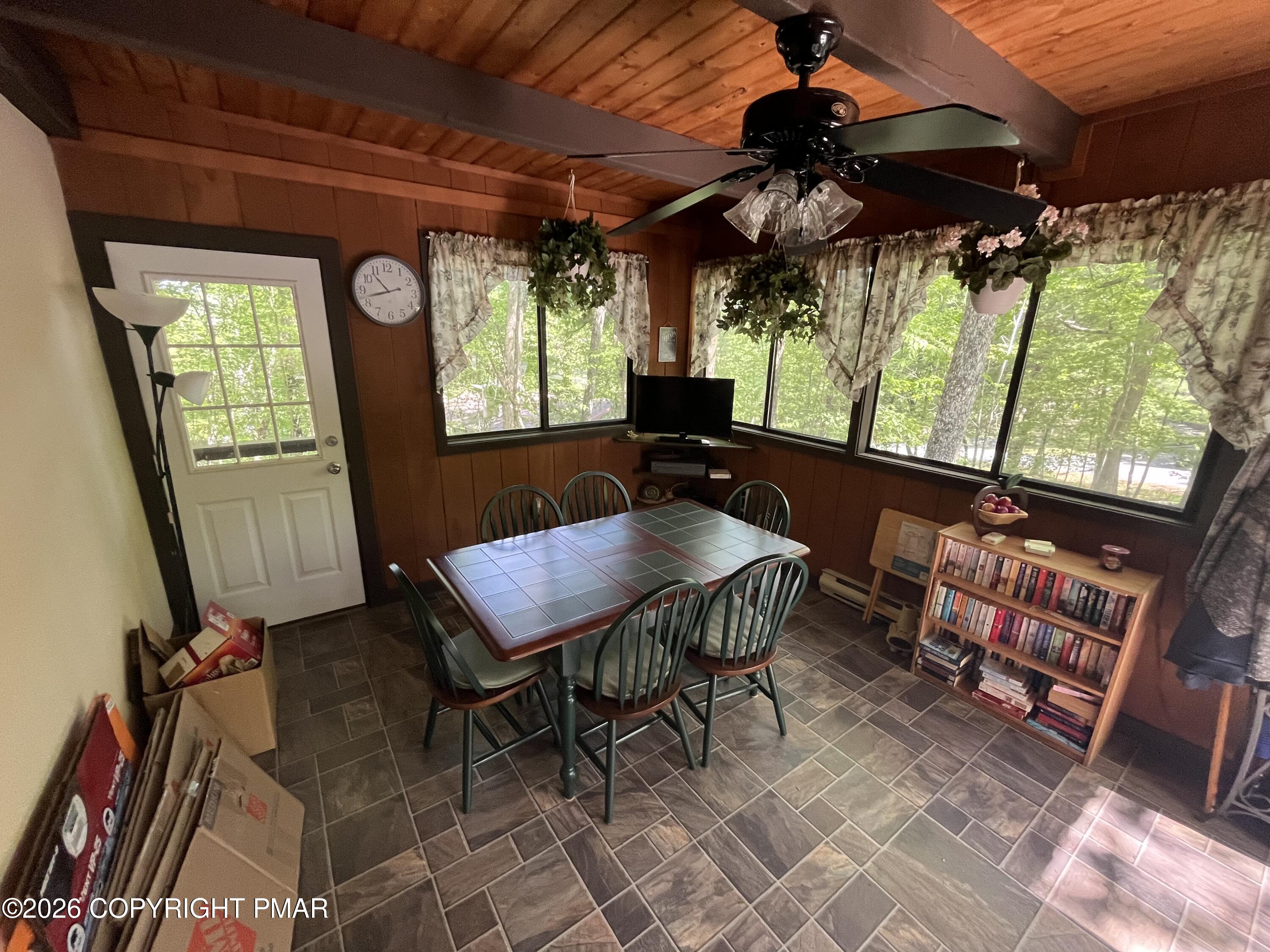 5970 Decker Road Bushkill, PA 18324 - Photo 11 of 26 a view of a patio with a table and chairs