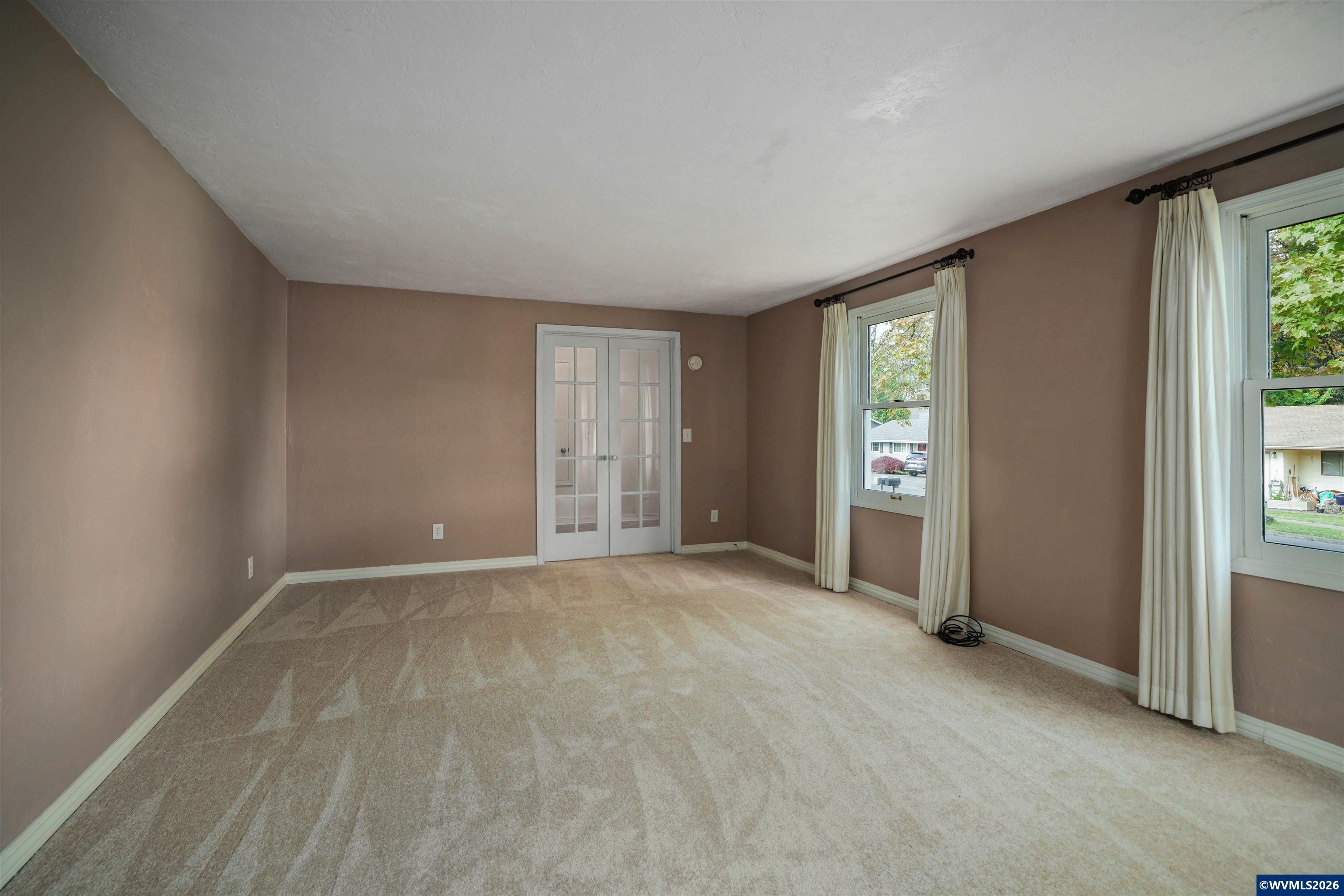 220 Northwest Downy Drive Sublimity, OR 97385 - Photo 14 of 47 an empty room with windows and closet