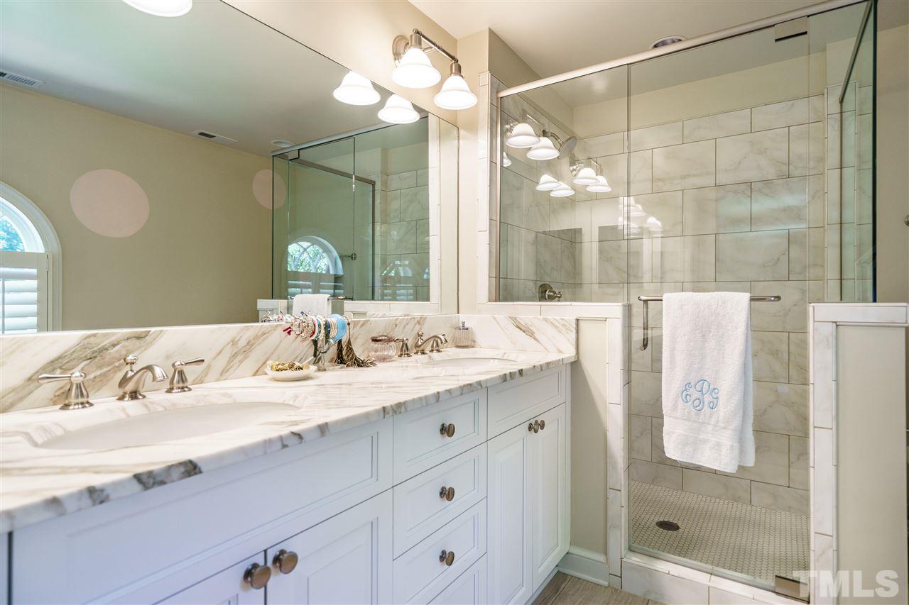 3300 Landor Road Raleigh, NC 27609 - Photo 14 of 25 a bathroom with a double vanity sink mirror and shower