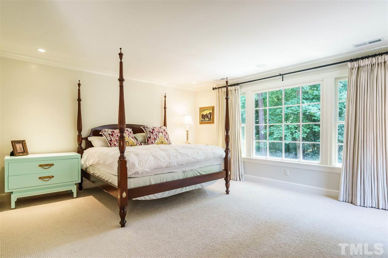 3300 Landor Road Raleigh, NC 27609 - Photo 15 of 25 a bedroom with a bed and large window