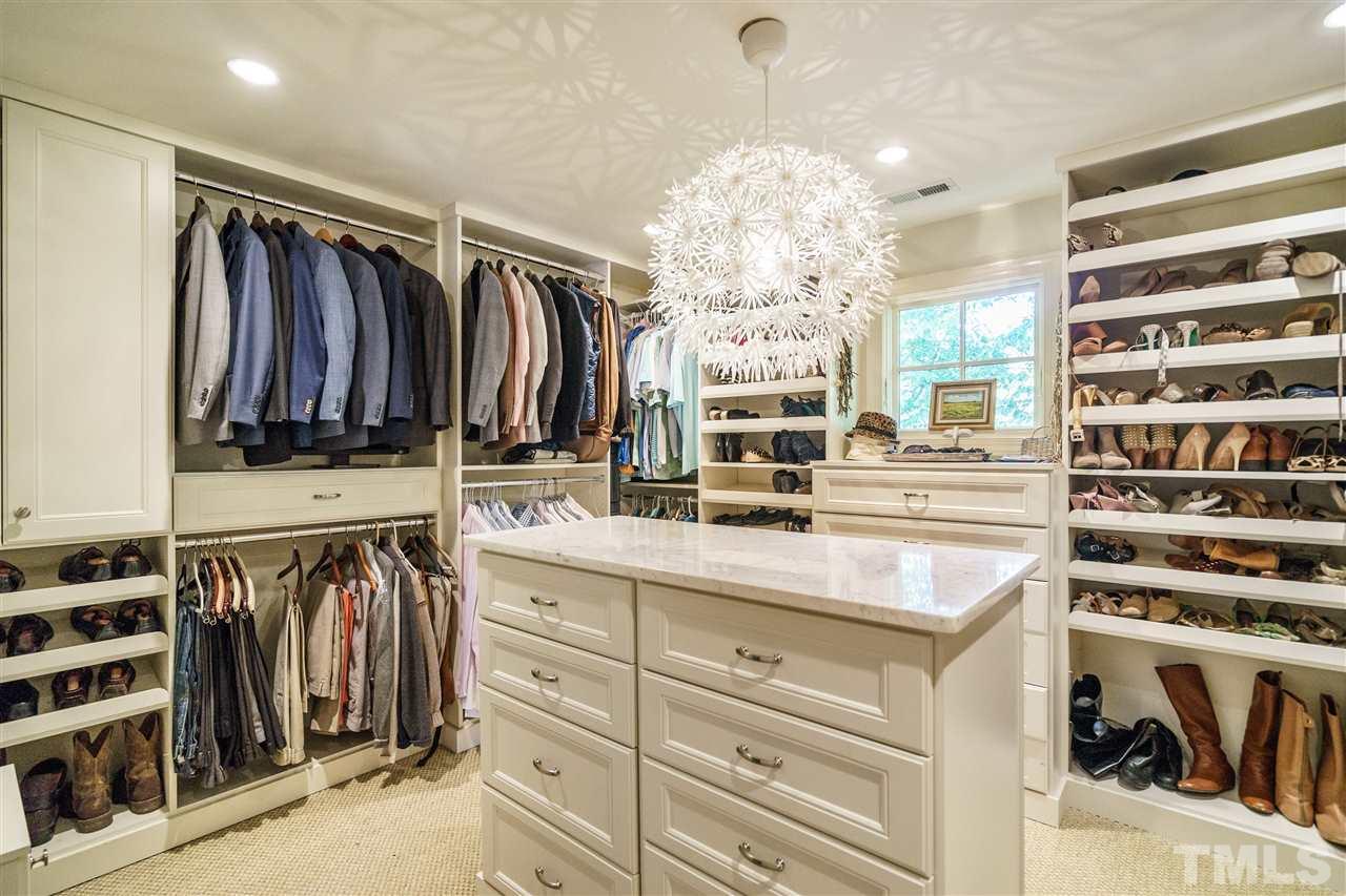 3300 Landor Road Raleigh, NC 27609 - Photo 17 of 25 a view of walk in closet with clothes and shoes