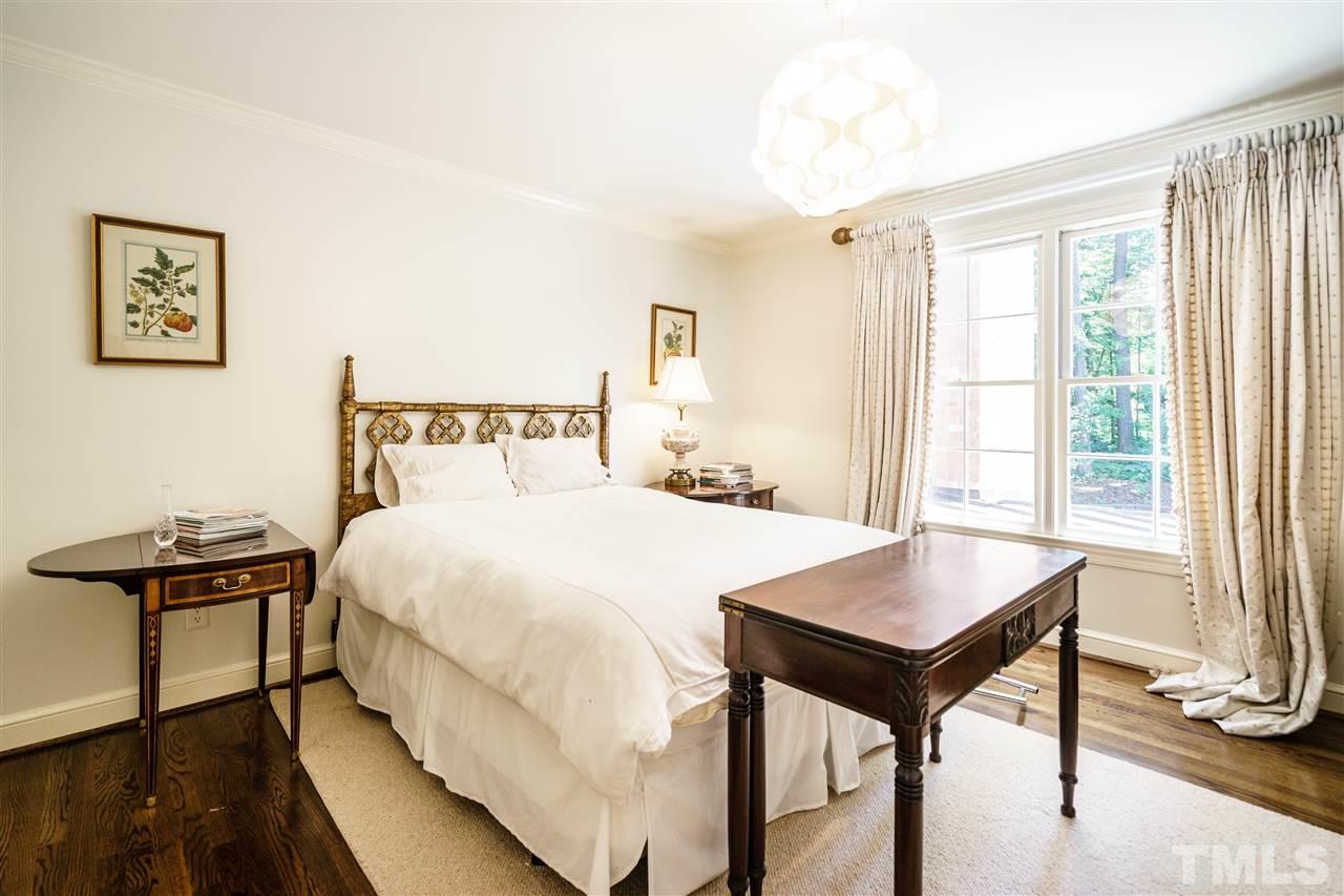 3300 Landor Road Raleigh, NC 27609 - Photo 18 of 25 a bed room with a bed and a table