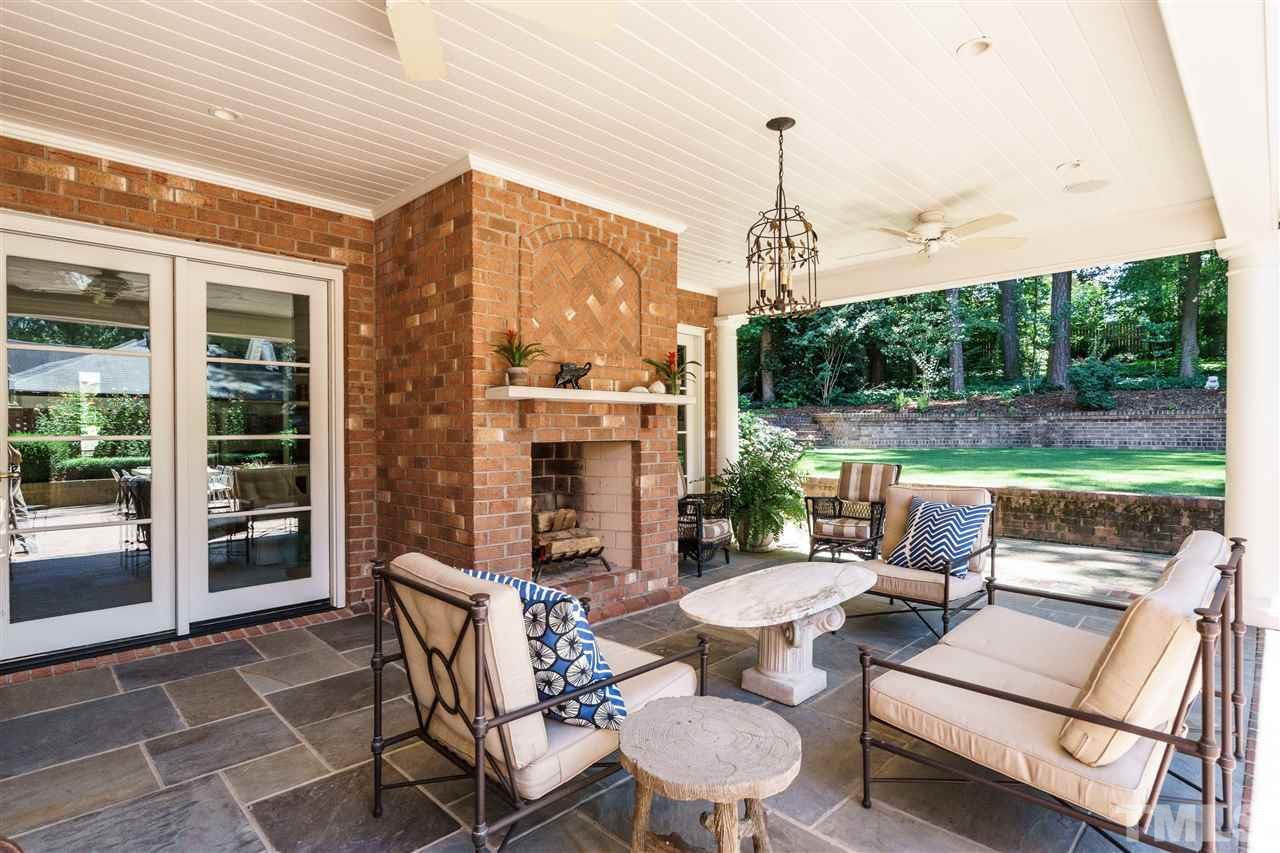 3300 Landor Road Raleigh, NC 27609 - Photo 20 of 25 a view of a patio with a dining table and chairs