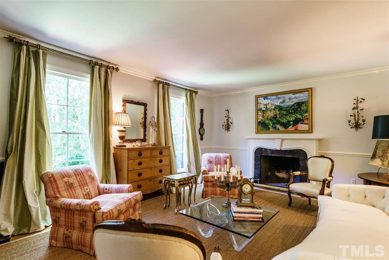 3300 Landor Road Raleigh, NC 27609 - Photo 3 of 25 a living room with furniture fireplace and a large window