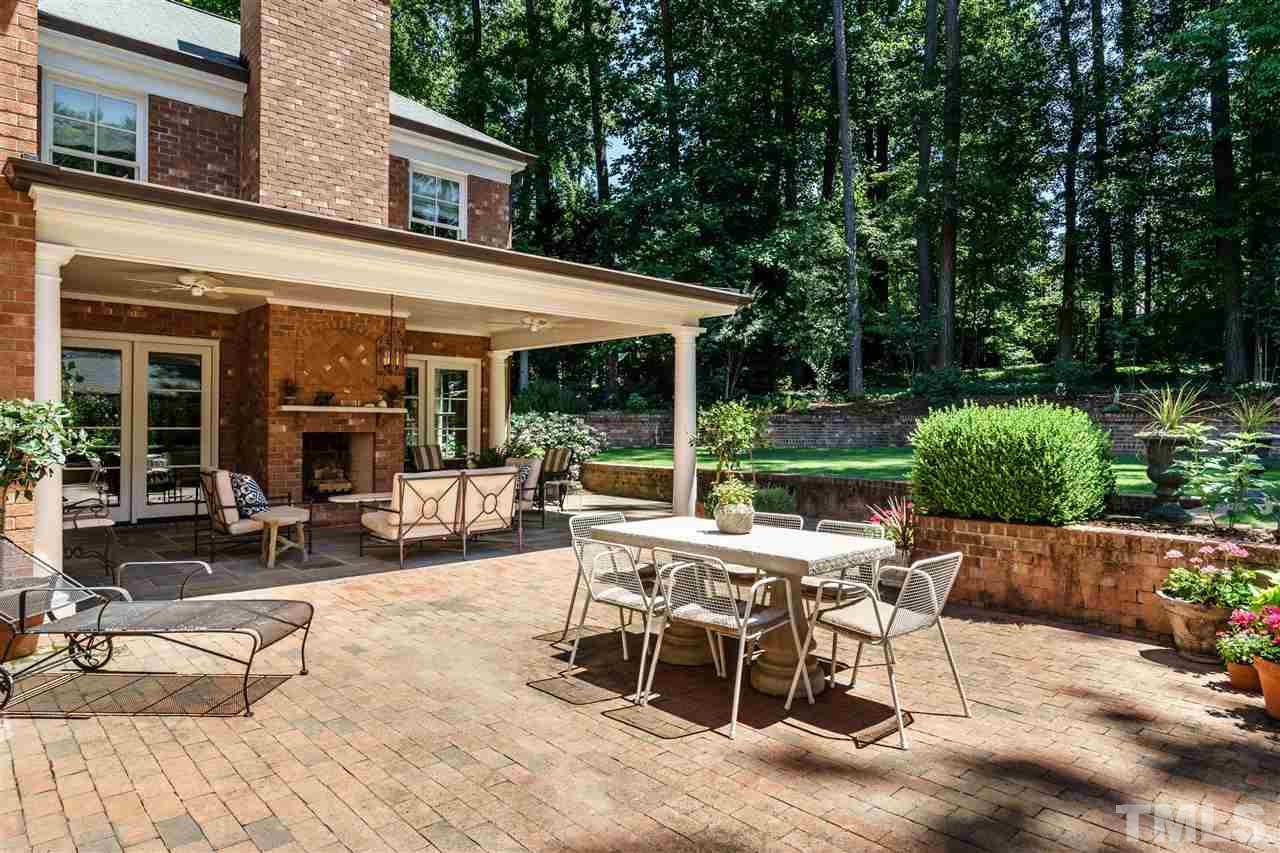 3300 Landor Road Raleigh, NC 27609 - Photo 21 of 25 a view of a patio with a table and chairs in patio