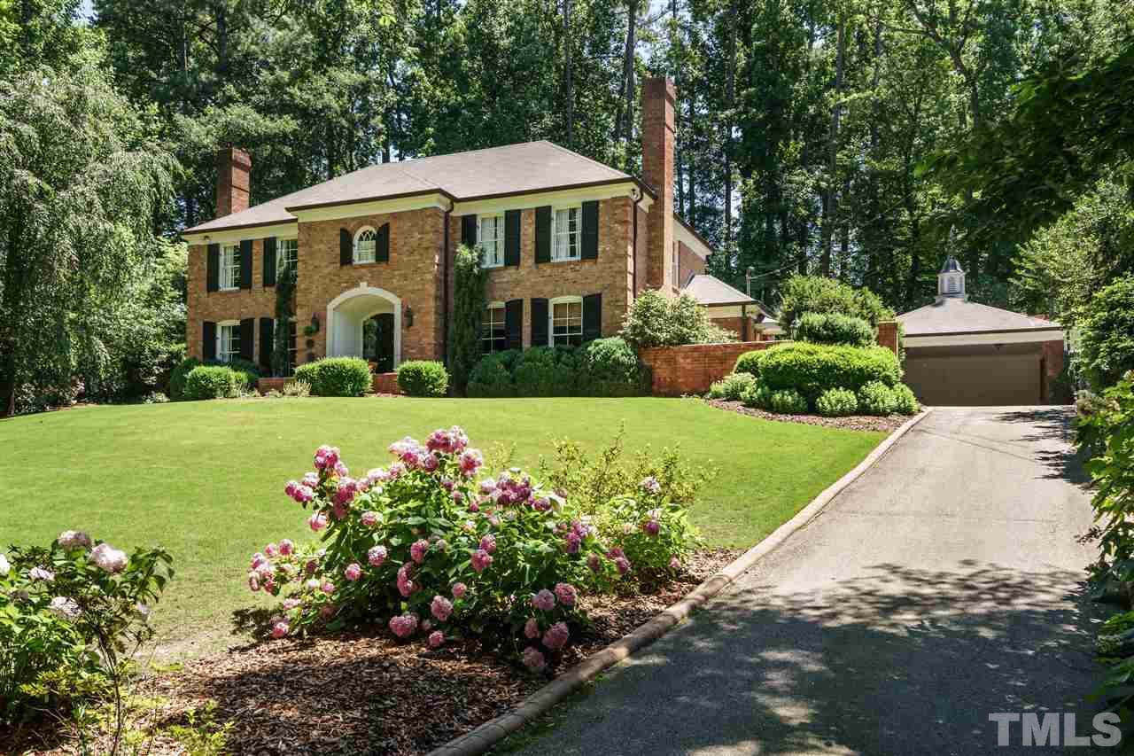 3300 Landor Road Raleigh, NC 27609 - Photo 25 of 25 a front view of a house with a yard and potted plants