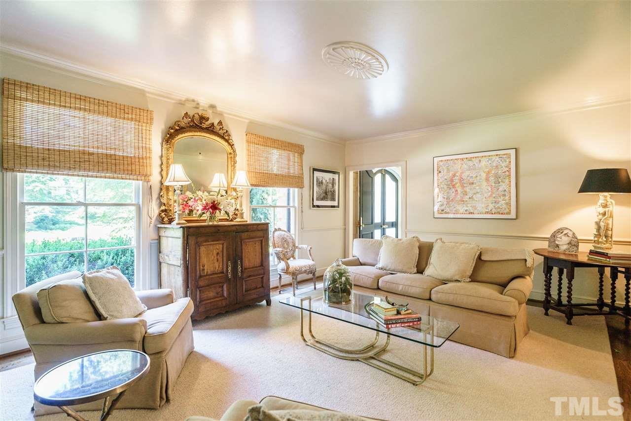3300 Landor Road Raleigh, NC 27609 - Photo 5 of 25 a living room with furniture and a fireplace