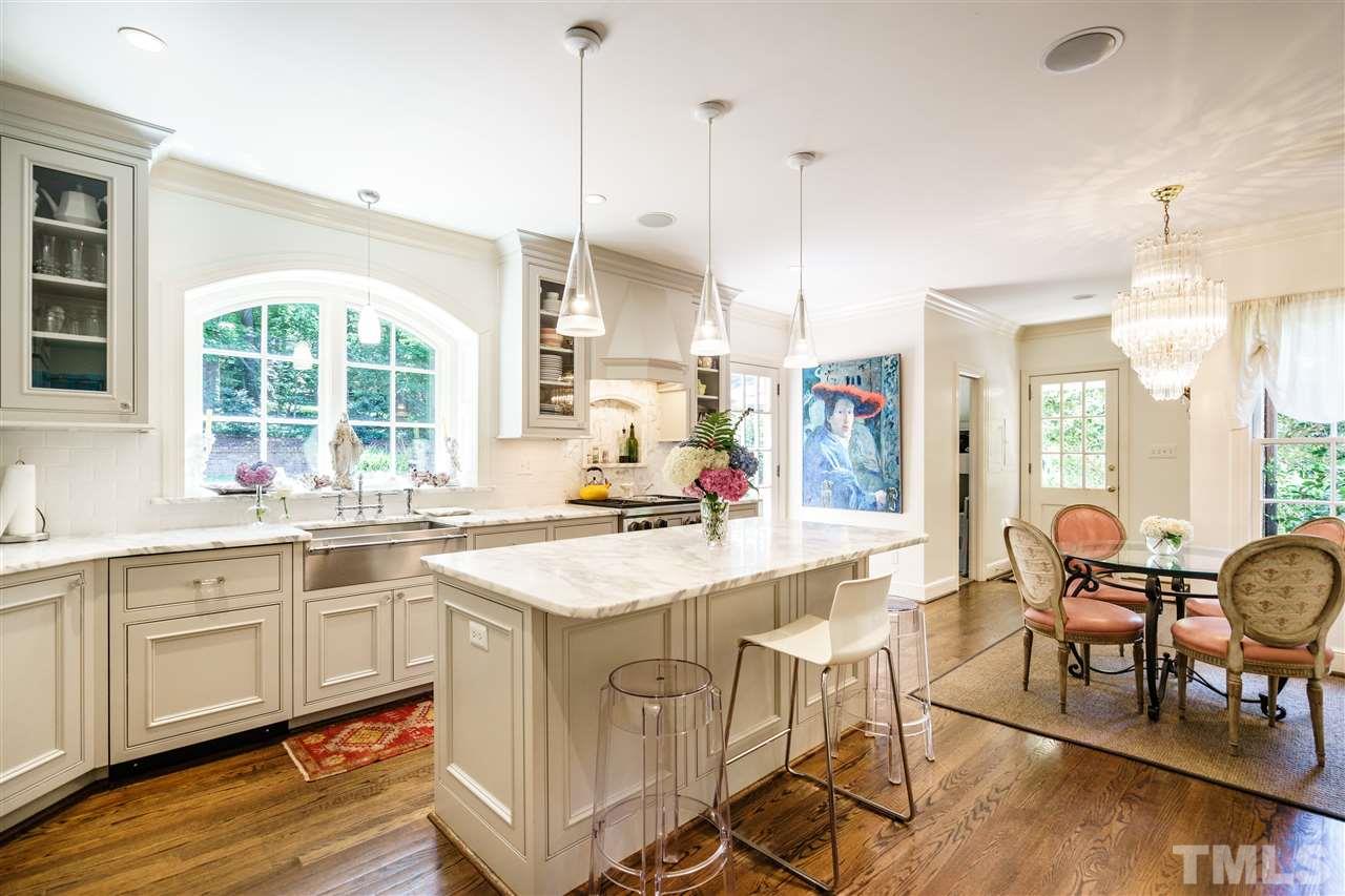 3300 Landor Road Raleigh, NC 27609 - Photo 6 of 25 a kitchen with a sink a counter top space and appliances