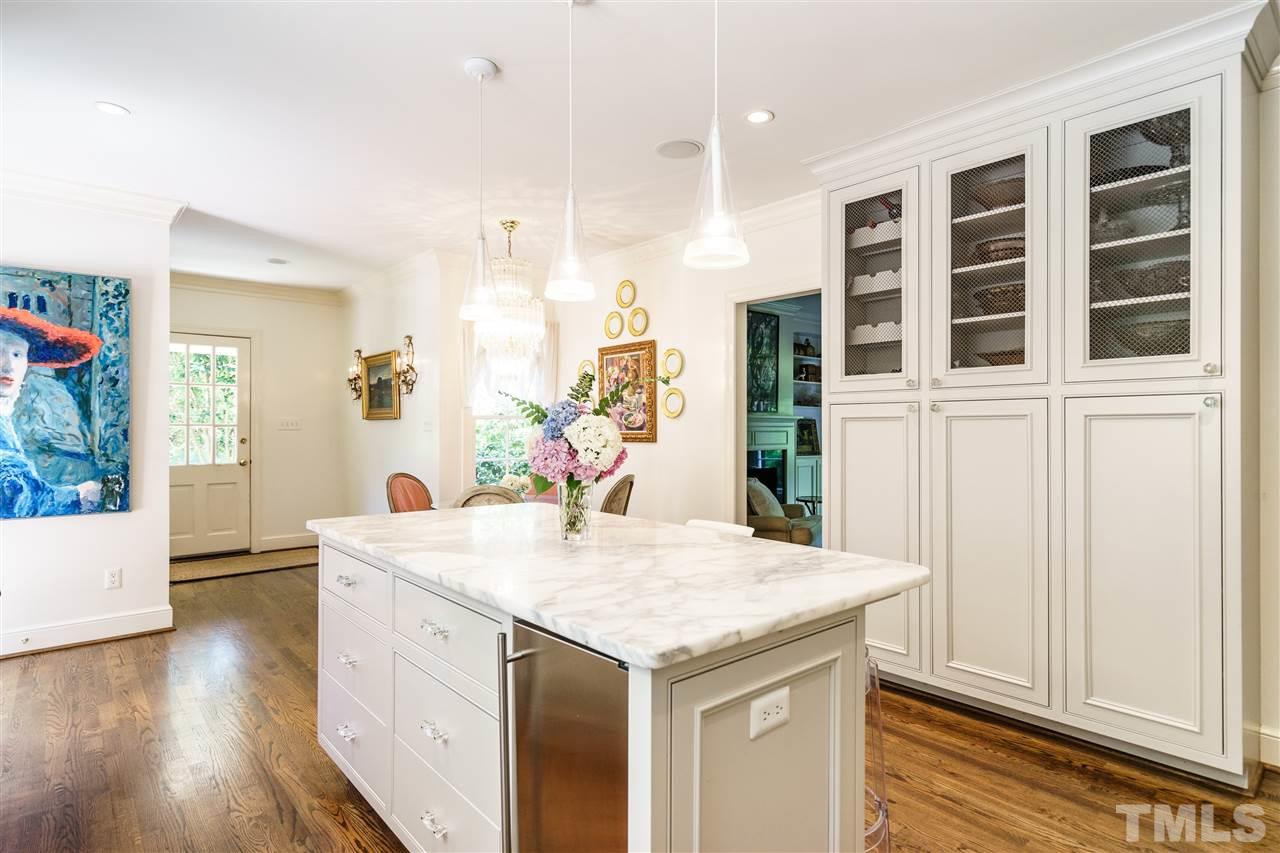 3300 Landor Road Raleigh, NC 27609 - Photo 8 of 25 a kitchen with a stove and a wooden floor